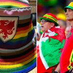 Fans timnas Wales dengan topi pelangi.