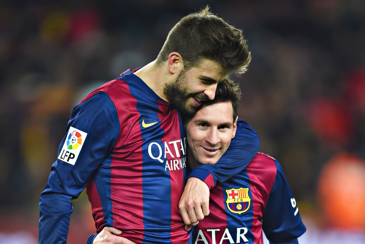 Gerard Pique dan Lionel Messi.